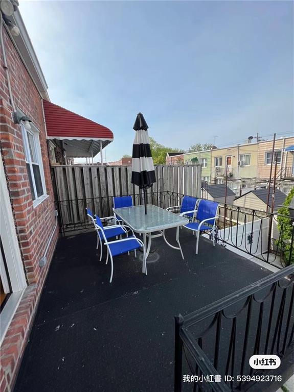 1574 E 66th St, Brooklyn, NY 11234 - view of patio with a balcony and outdoor dining area
