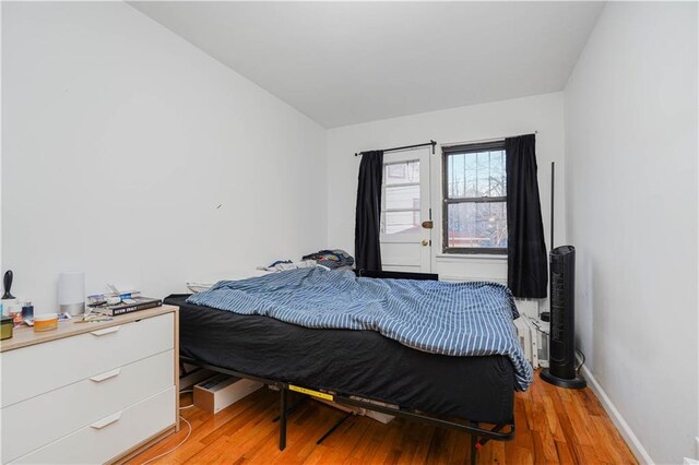 bedroom with light hardwood / wood-style flooring