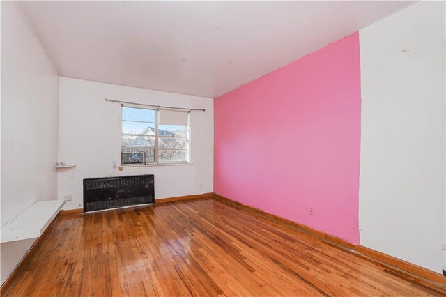 unfurnished living room featuring wood-type flooring