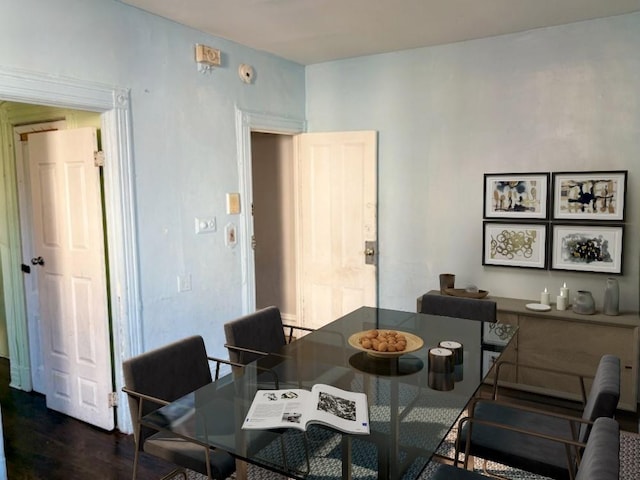 dining area with dark hardwood / wood-style flooring