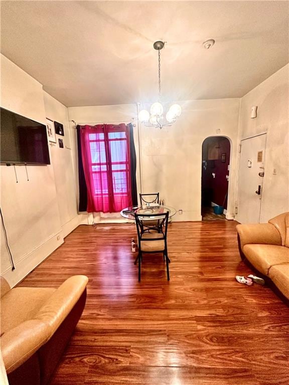 living room featuring hardwood / wood-style floors and an inviting chandelier