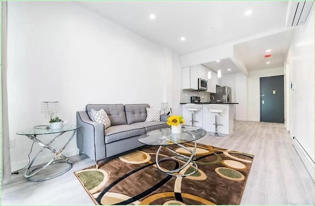 living room with light hardwood / wood-style flooring