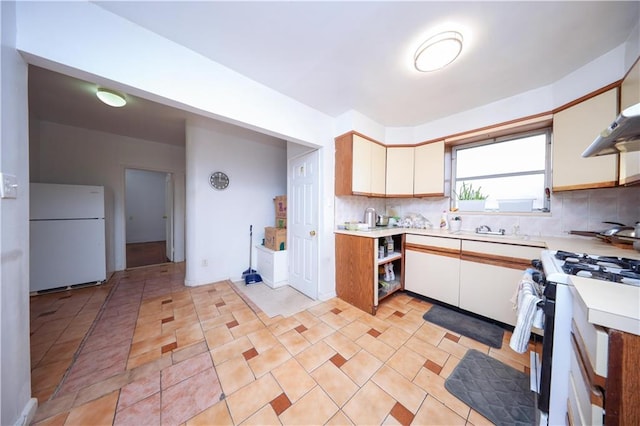 1445 W 5th St, Brooklyn, NY 11204 - kitchen featuring light countertops, stainless steel gas range oven, freestanding refrigerator, and tasteful backsplash