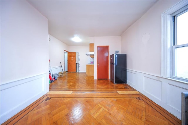 1445 W 5th St, Brooklyn, NY 11204 - spare room featuring a decorative wall and wainscoting