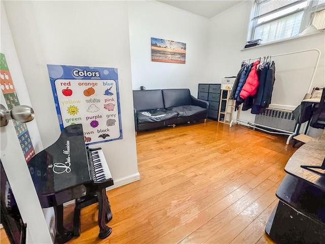 misc room featuring radiator and hardwood / wood-style floors