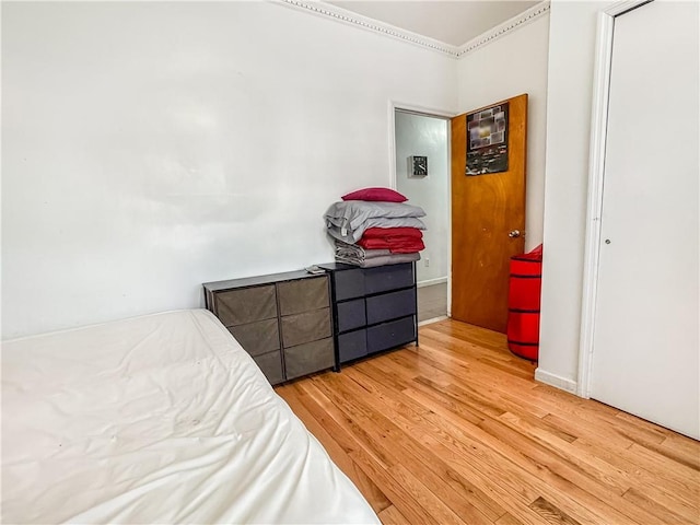 bedroom with light wood-type flooring