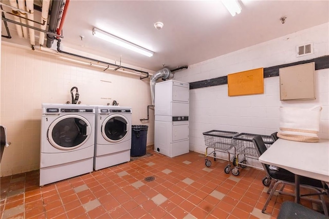 laundry room featuring stacked washing maching and dryer