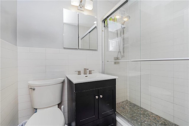 full bathroom featuring a stall shower, toilet, and tile walls