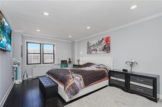 bedroom with crown molding, wood finished floors, baseboards, radiator, and recessed lighting