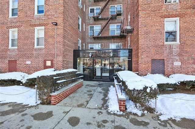 view of snow covered property entrance