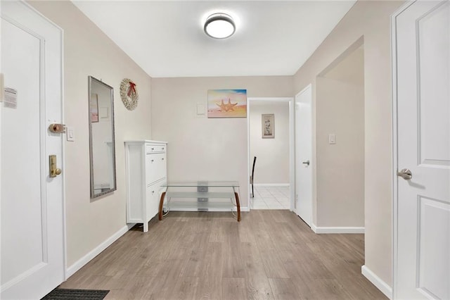 hallway featuring light wood-type flooring