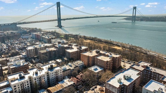 birds eye view of property featuring a water view and a city view