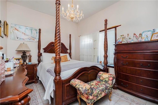 bedroom with light tile patterned floors and an inviting chandelier