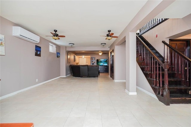 unfurnished living room with stairway, ceiling fan, an AC wall unit, and light tile patterned flooring
