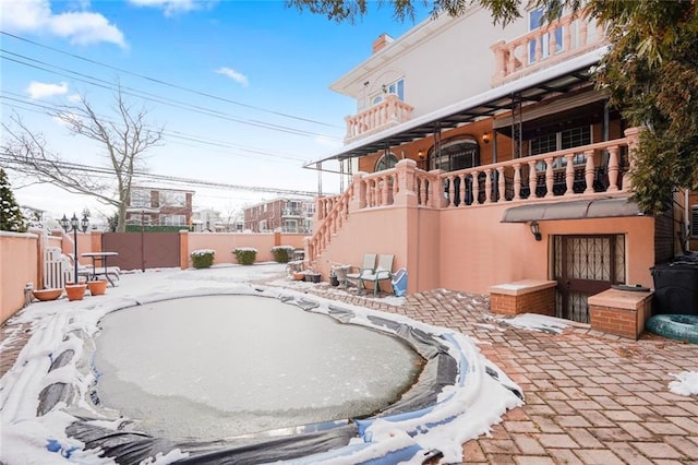 view of yard with fence and a balcony