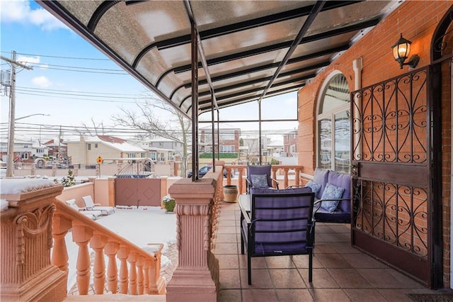 view of patio featuring a balcony