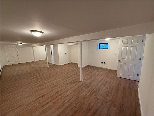 basement featuring dark hardwood / wood-style floors