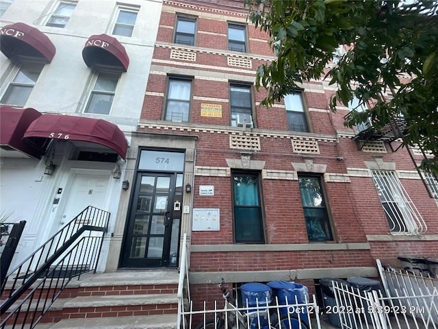 view of building exterior featuring fence