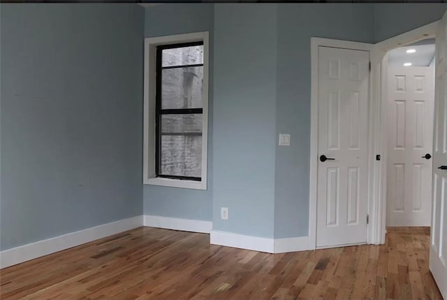 unfurnished bedroom with light hardwood / wood-style floors