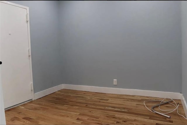 unfurnished room featuring hardwood / wood-style flooring