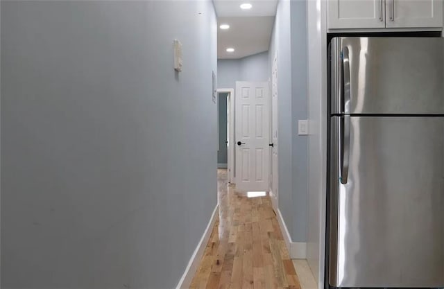 hall with light hardwood / wood-style flooring