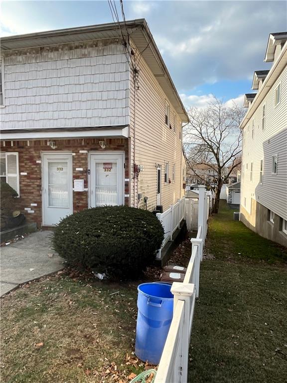 view of home's exterior with a yard