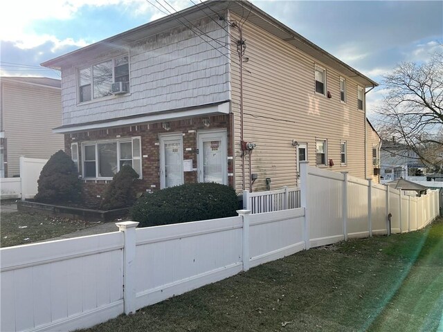 view of home's exterior with a yard