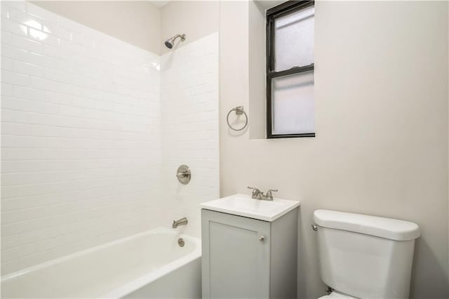 full bath with shower / bath combination, vanity, and toilet