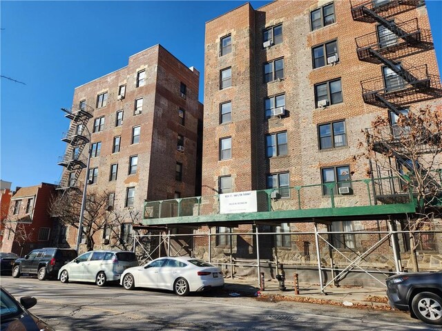 view of building exterior with cooling unit