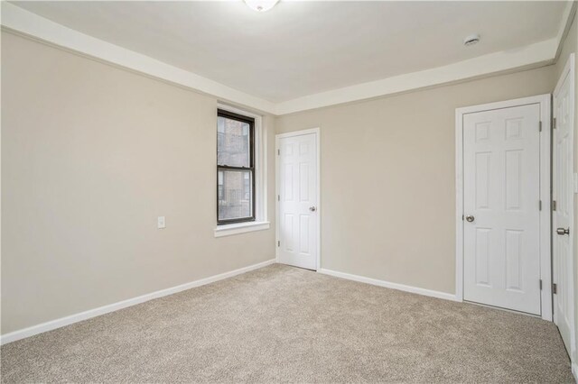 unfurnished room with carpet flooring