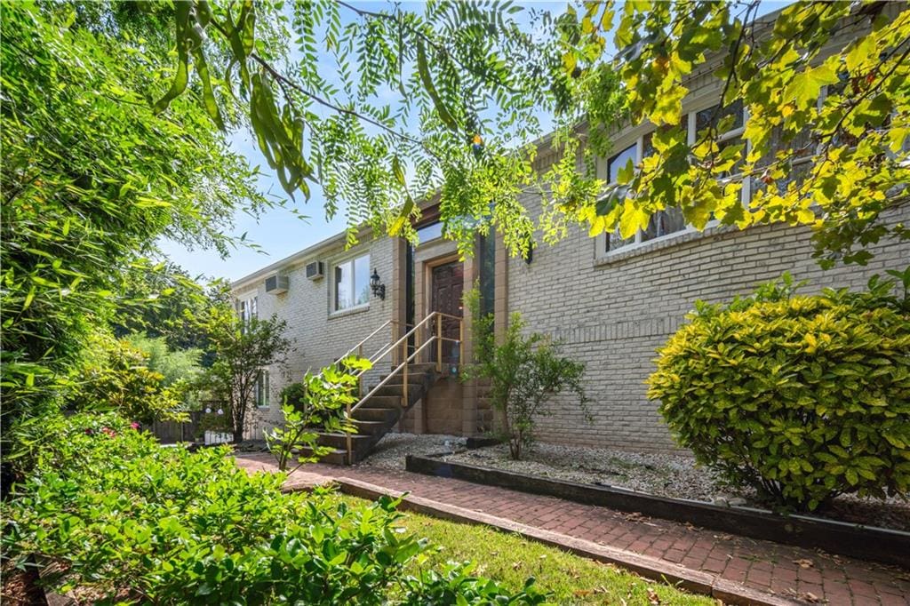 exterior space featuring brick siding