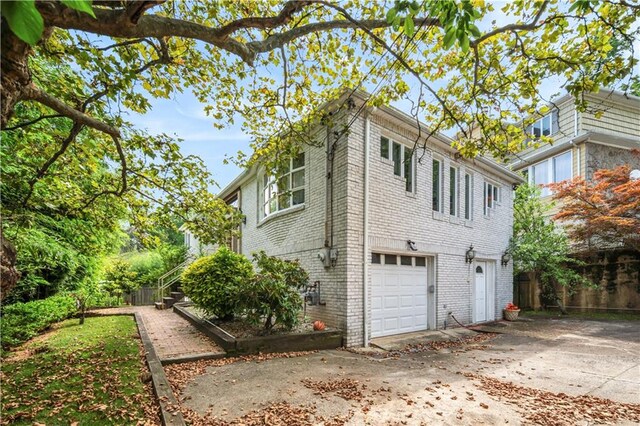 view of home's exterior with a garage