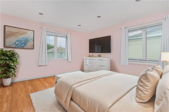 bedroom with light hardwood / wood-style floors