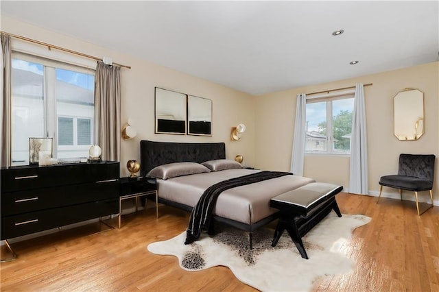 bedroom with light hardwood / wood-style flooring