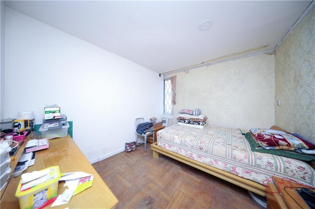 bedroom featuring parquet floors