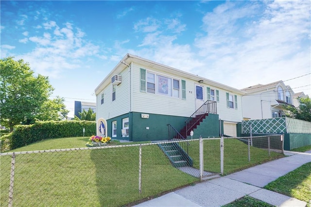 view of front of house with a front yard and an AC wall unit