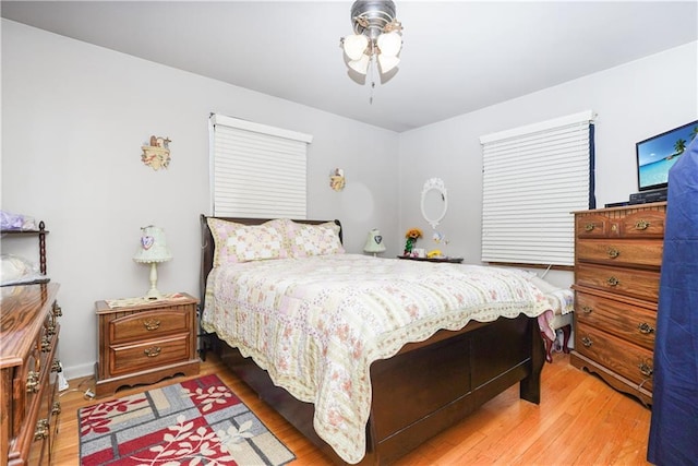 bedroom with hardwood / wood-style floors