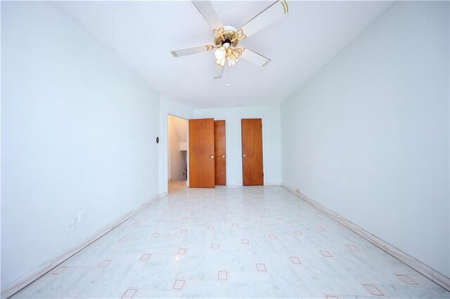 spare room featuring ceiling fan