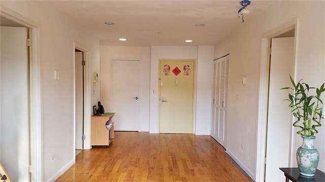 hallway featuring light hardwood / wood-style flooring