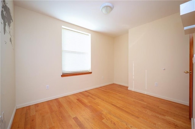 unfurnished room with light hardwood / wood-style floors