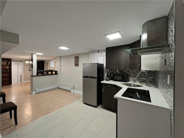 4912 Surf Ave, Brooklyn, NY 11224 - kitchen with wall chimney range hood, a sink, a baseboard heating unit, black appliances, and backsplash