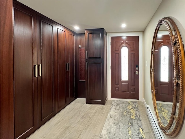 4912 Surf Ave, Brooklyn, NY 11224 - foyer entrance featuring recessed lighting, light wood-style flooring, and a baseboard radiator