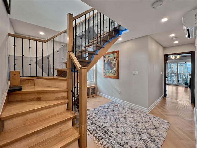 4912 Surf Ave, Brooklyn, NY 11224 - stairs with recessed lighting, visible vents, and baseboards