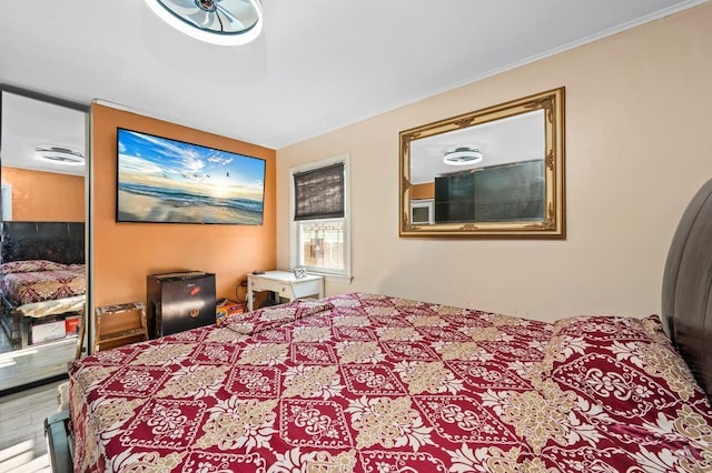 bedroom featuring crown molding