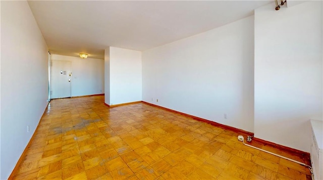 unfurnished room featuring light parquet floors