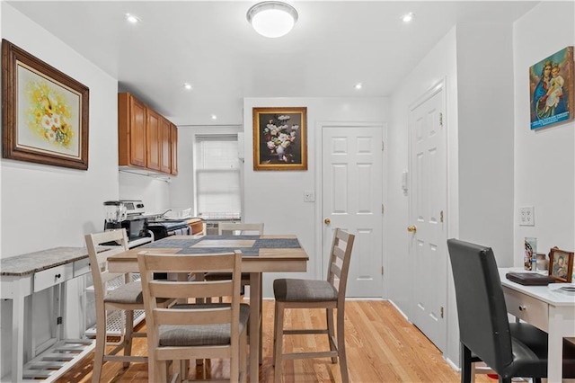 dining space featuring light wood-type flooring