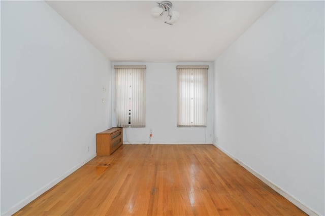 spare room featuring light wood-type flooring