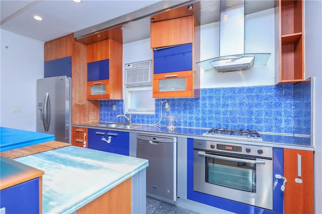 kitchen featuring tasteful backsplash, appliances with stainless steel finishes, a wall mounted air conditioner, wall chimney range hood, and stainless steel counters