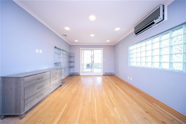 spare room with light hardwood / wood-style flooring, a wall mounted air conditioner, a baseboard radiator, and ornamental molding