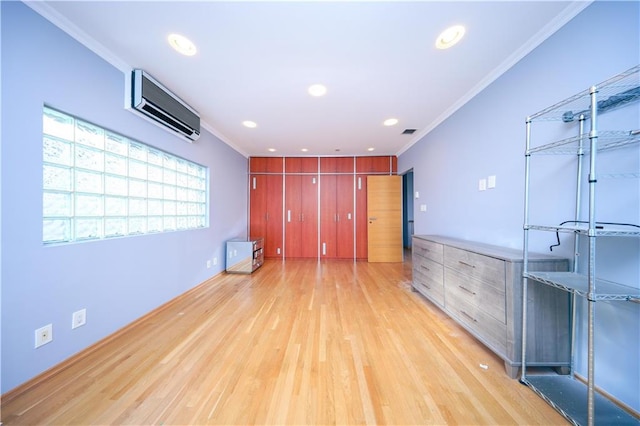 unfurnished room with light wood finished floors, recessed lighting, visible vents, a wall mounted AC, and ornamental molding